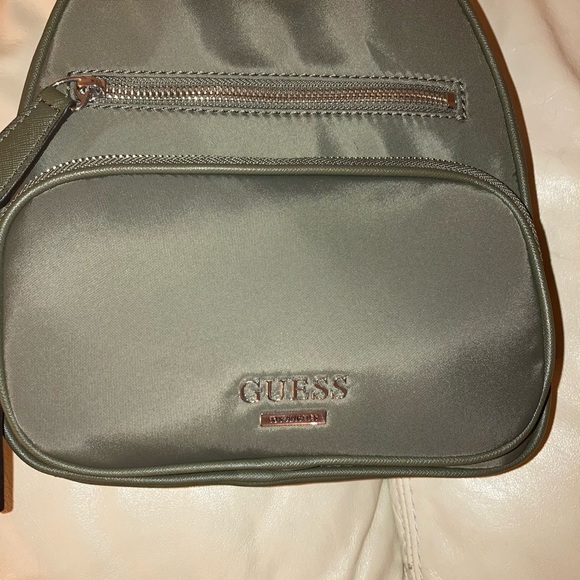 Guess Green Small Nylon Backpack:small discoloration inside by tag. Looks new. - Picture 3 of 13